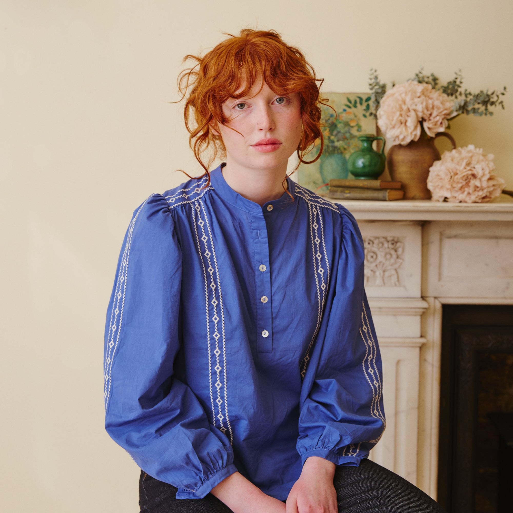 Blue shirt with white embroidery
