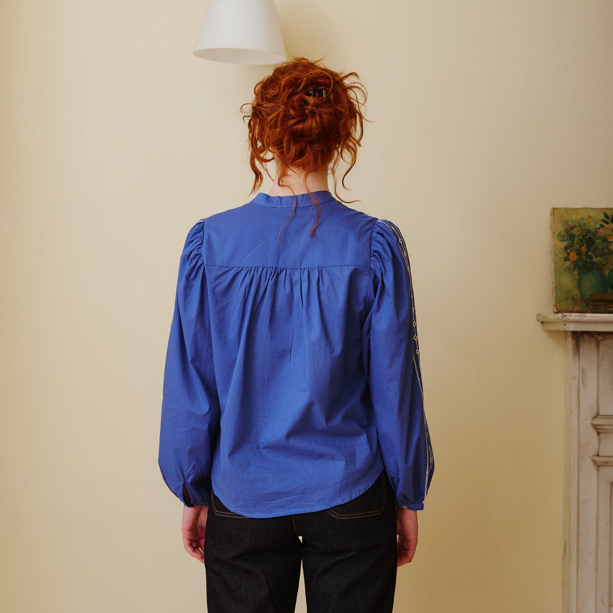Pleated back blue blouse