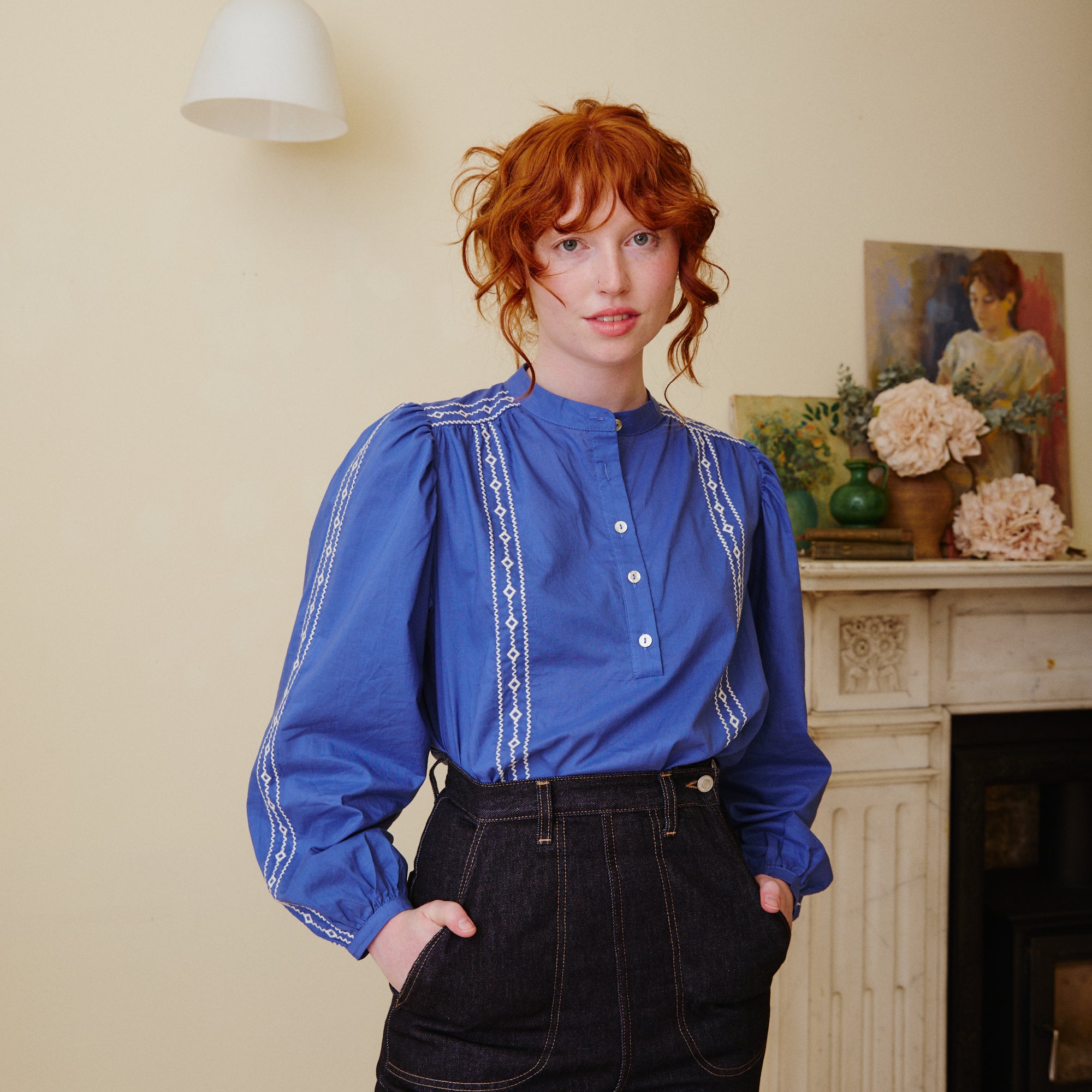 Blue collarless blouse with embroidery detail