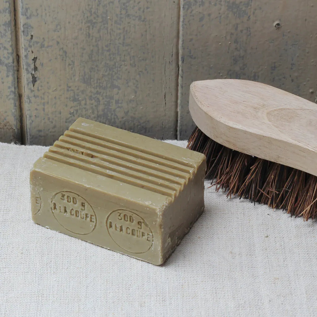 Wooden scrubbing brush and laundry soap