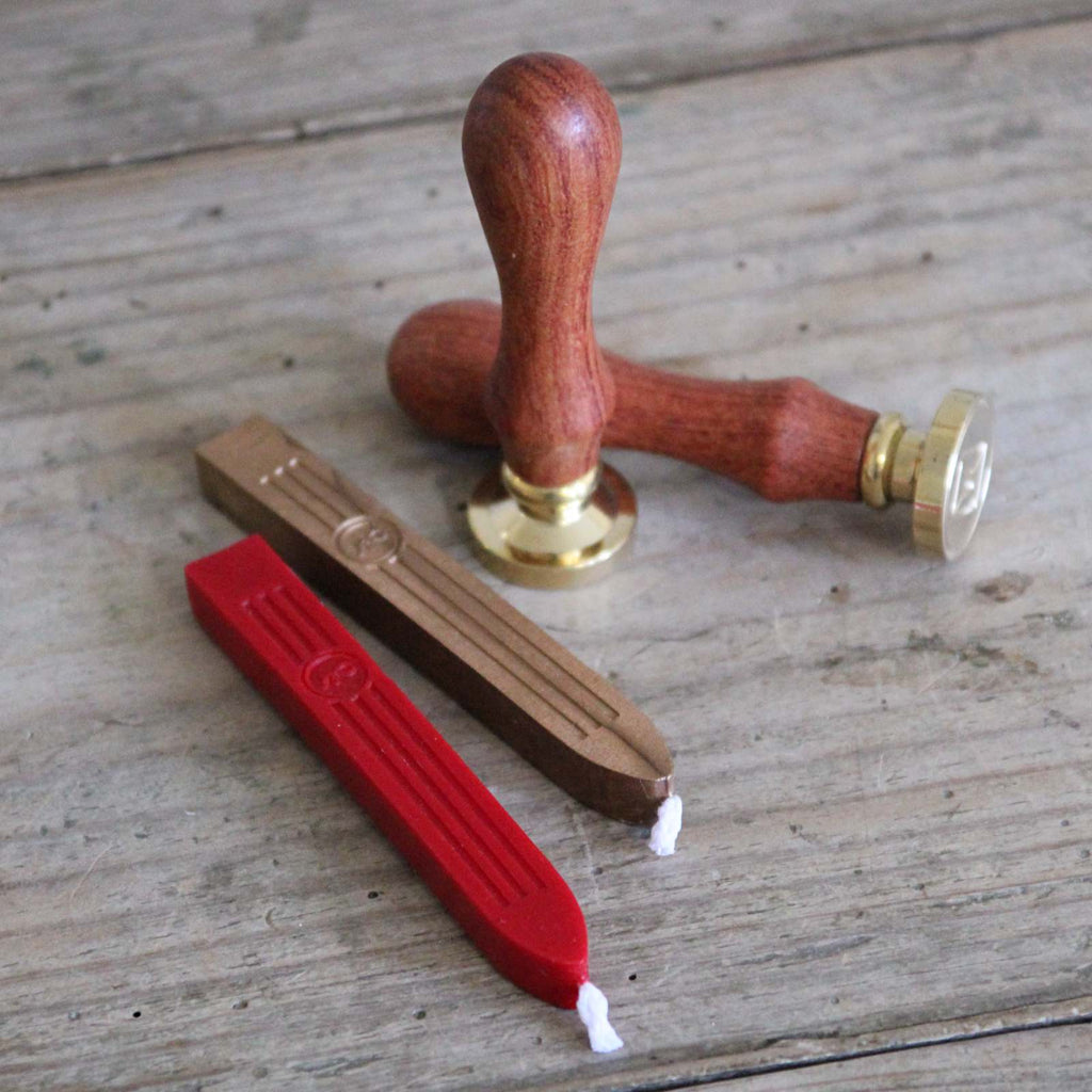 Traditional Wax Seal Stamp with a wooden handle and sealing wax