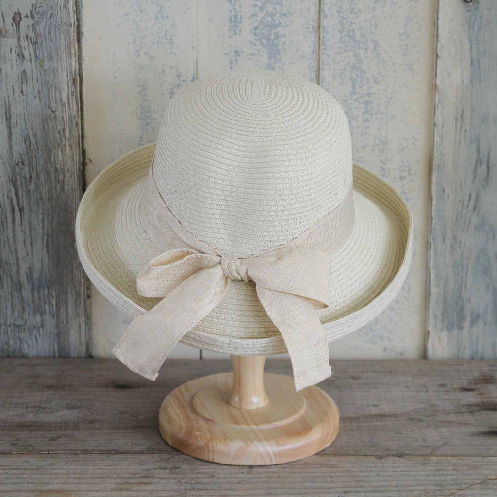 Classic camel coloured sun hat, with a matching ribbon and bow detail.