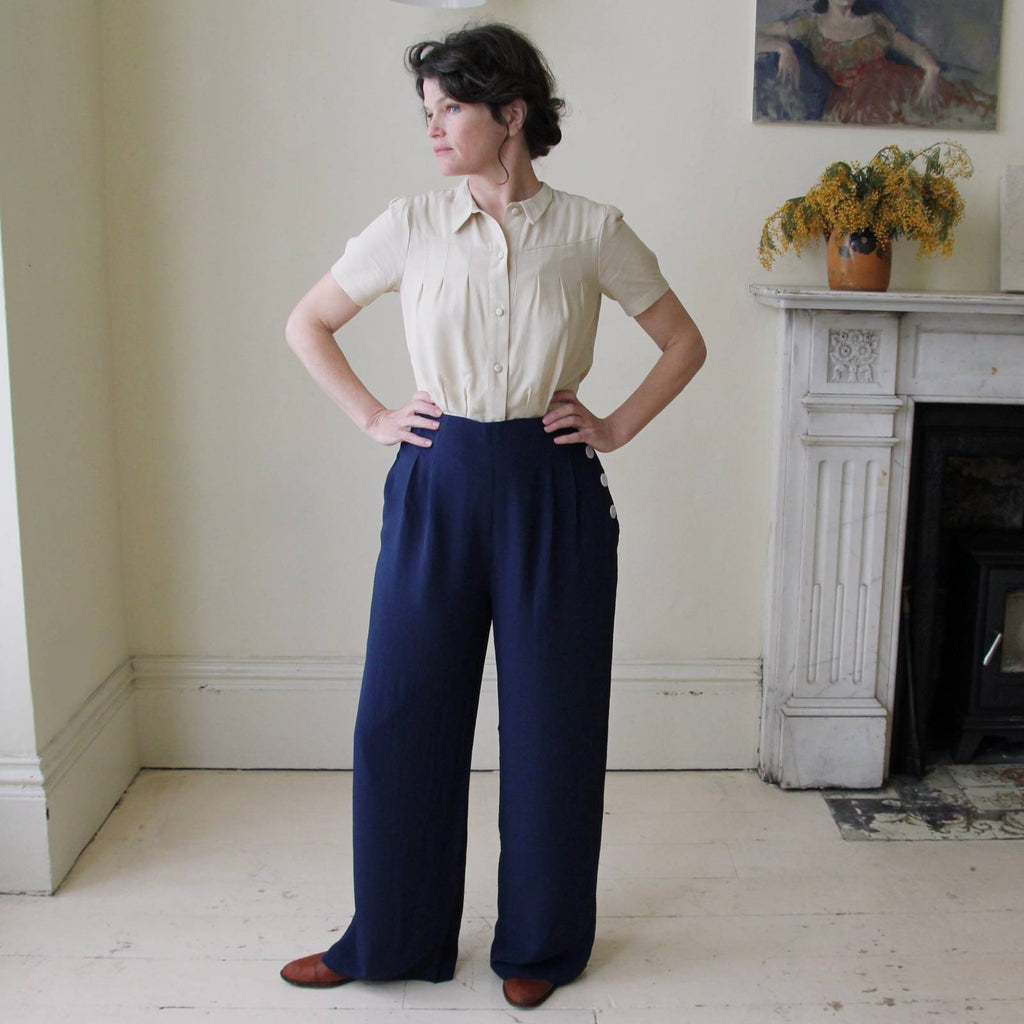 Classic 1940's high waisted, vintage trousers with white buttons down one side