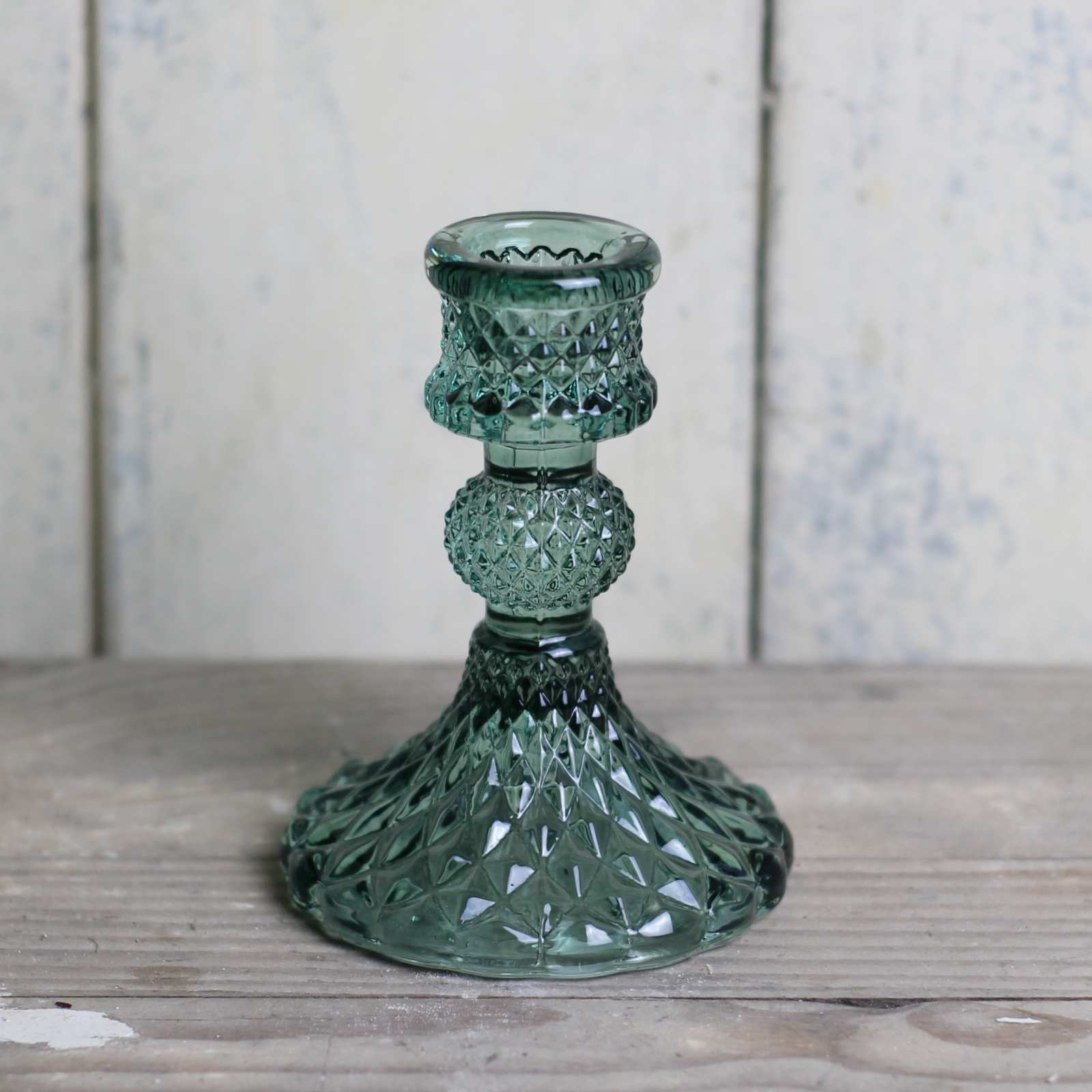 Candlestick in green cut glass