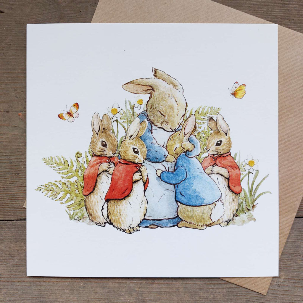 Greeting card by Beatrix Potter. Peter Rabbit and the Flopsy Bunnies hug mother rabbit, a lovely Mother's Day card or Easter card