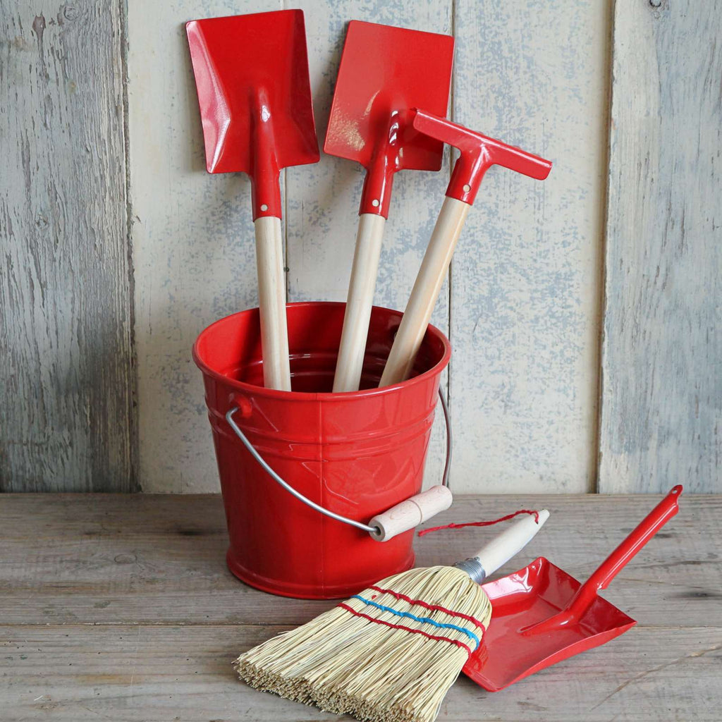 Children's red enamel bucket and gardening tools