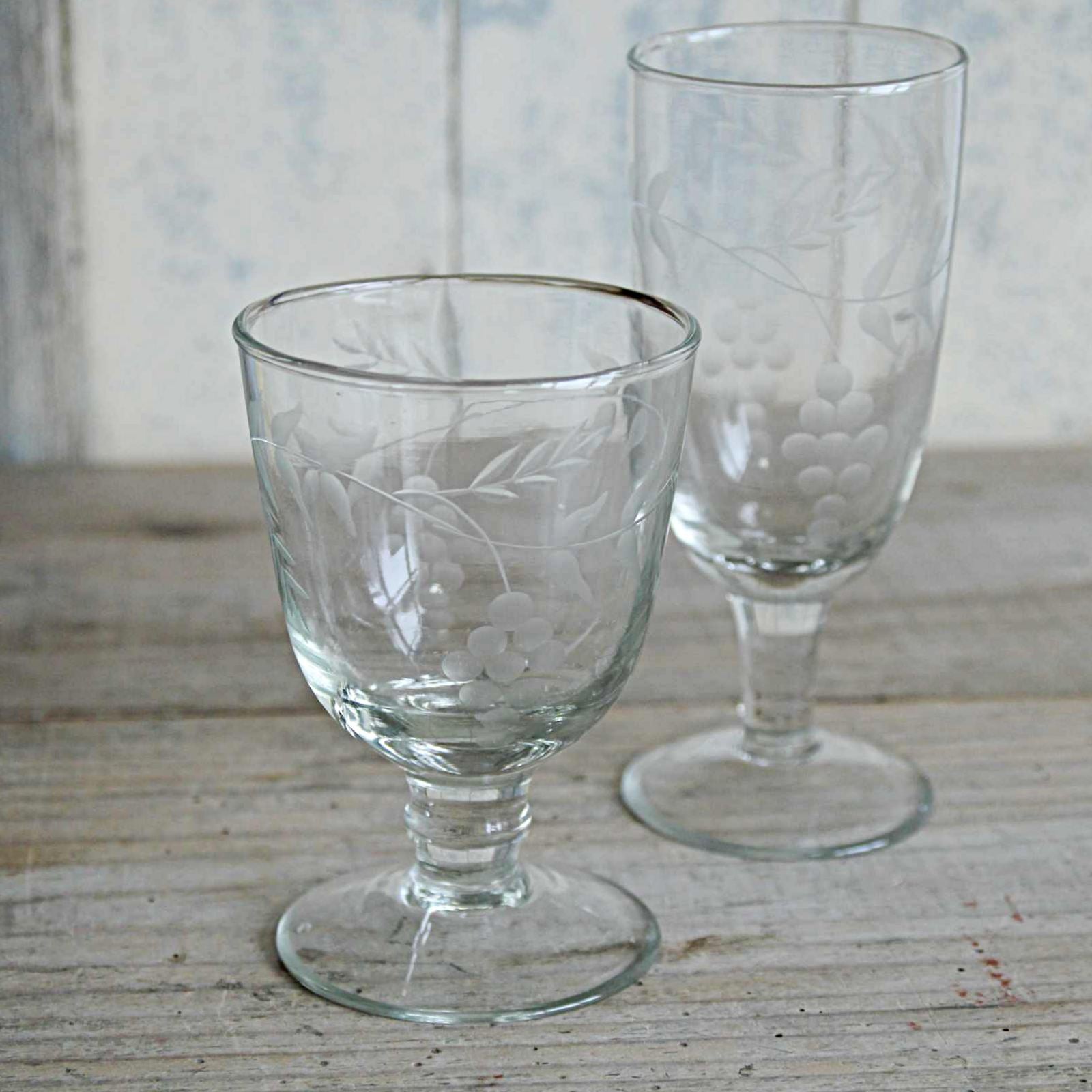 Elegant vintage style wine glass, hand blown and etched with a delicate pattern of rambling vine leaves. With matching Champagne glass