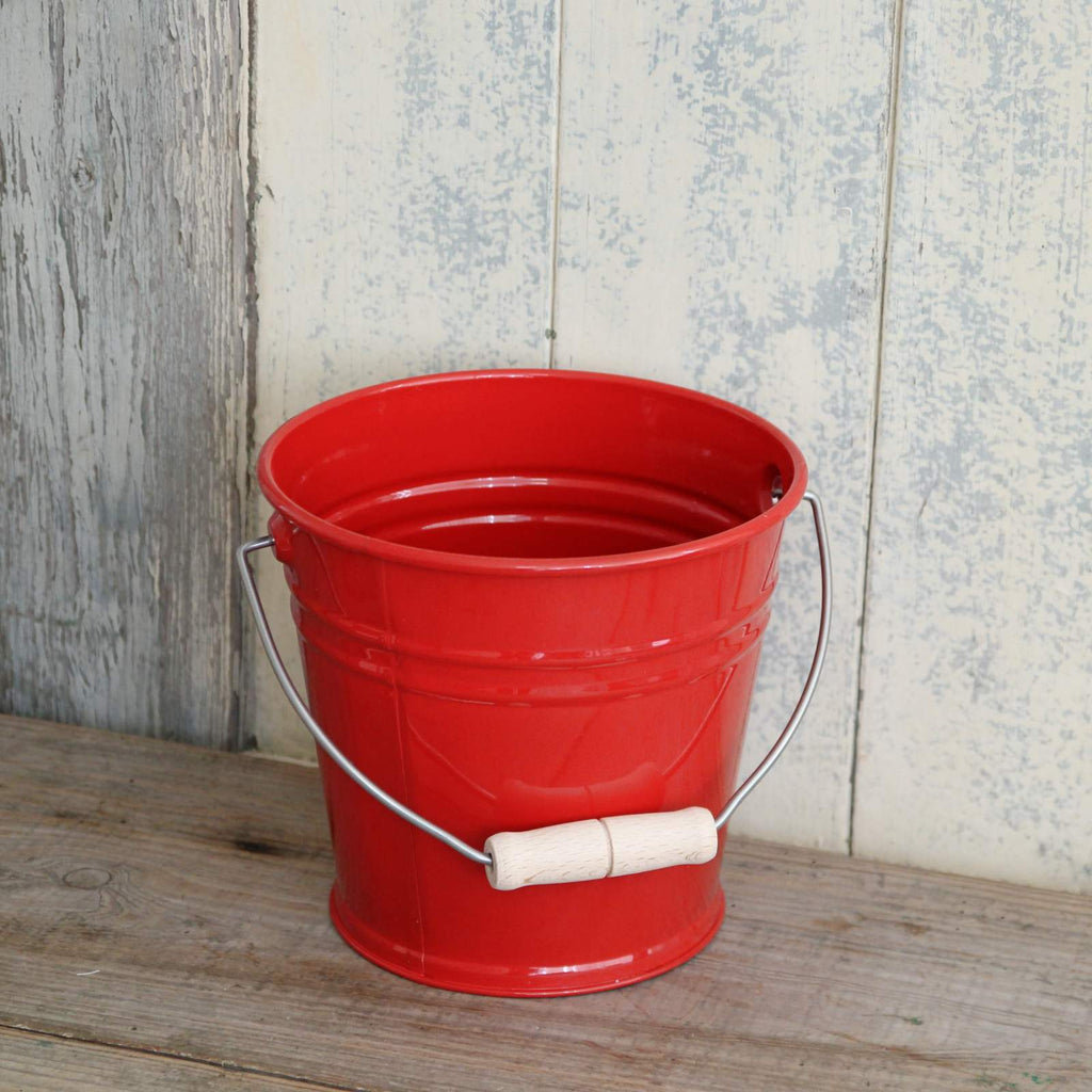 Children's red enamel bucket with wooden handle
