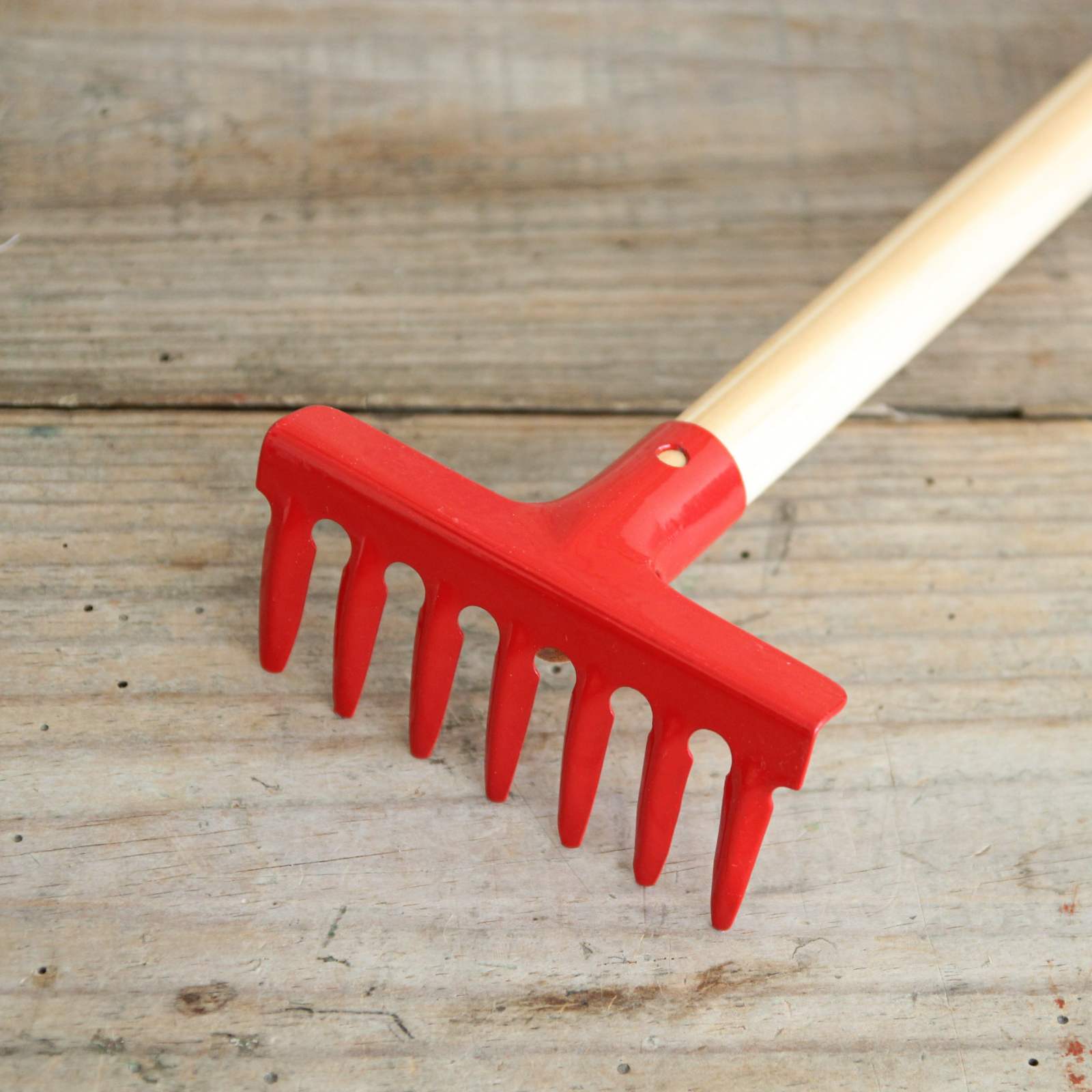 Red enamel garden rake
