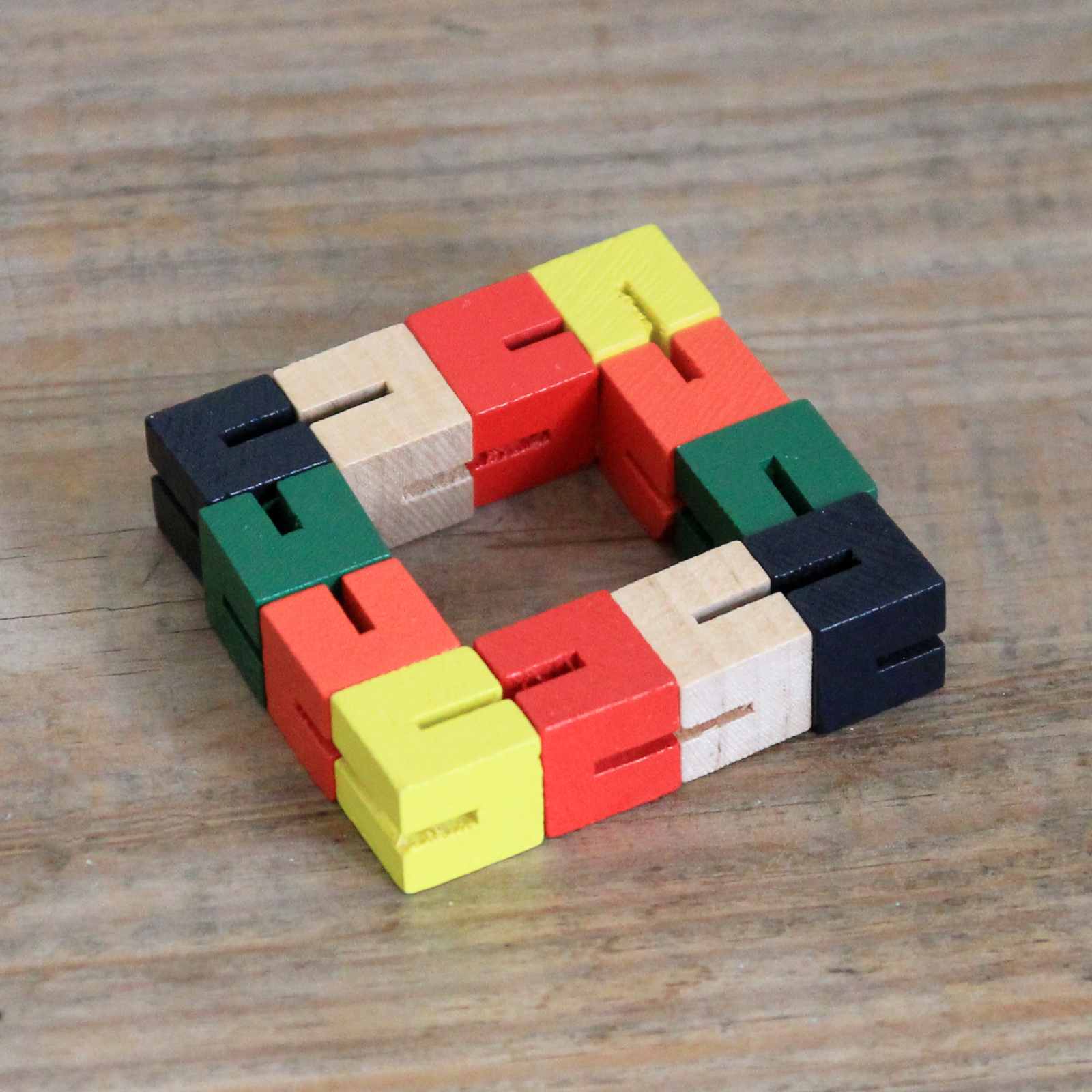 Colourful interlocking wooden puzzle fidget toy
