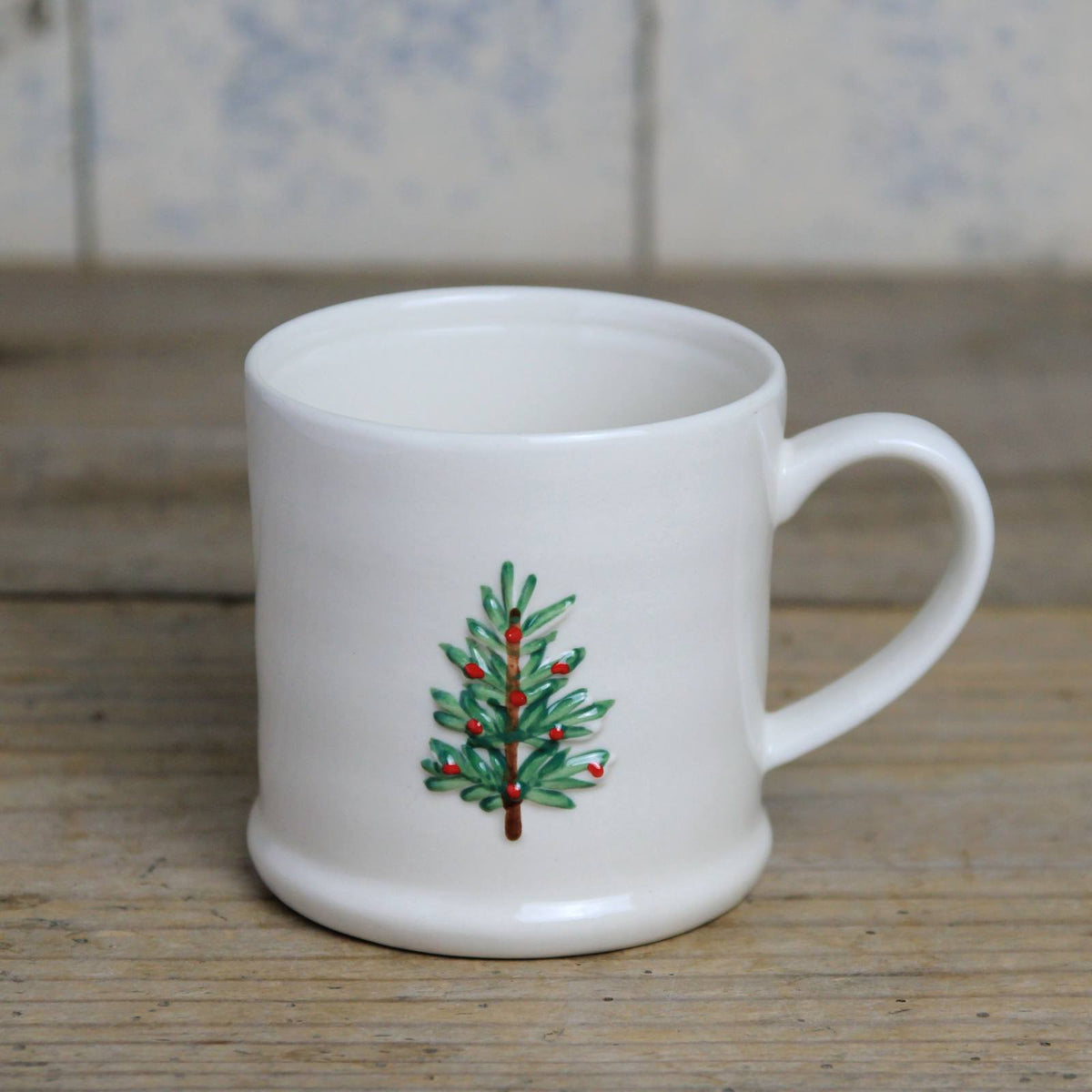 Small cream stoneware mug, with a Christmas Tree
