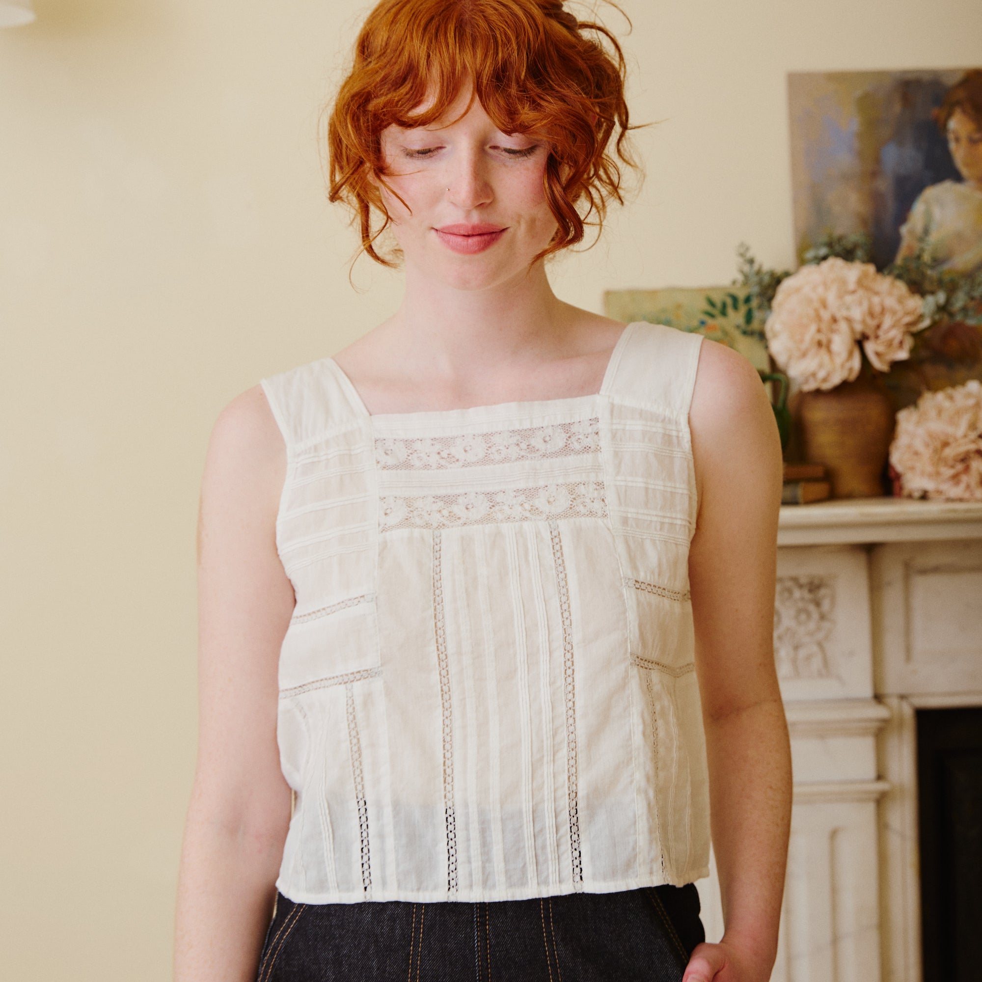 Sleeveless white cotton lace top