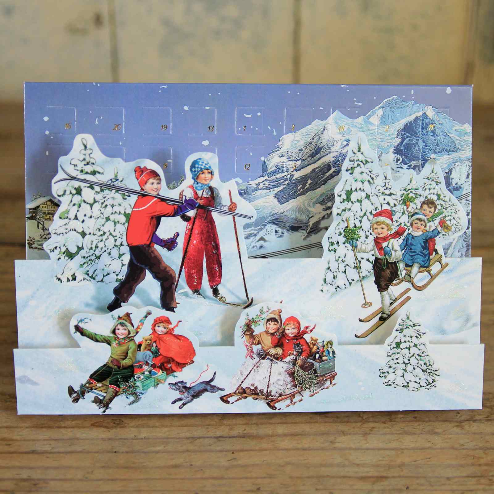 Vintage-style Christmas card with children playing in a snowy landscape