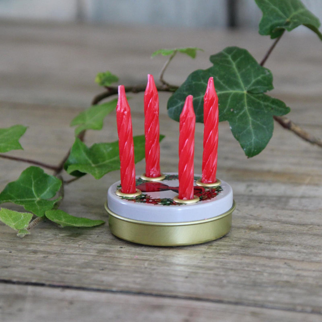 Traditional Miniature Advent Tin comes with four tiny red candles