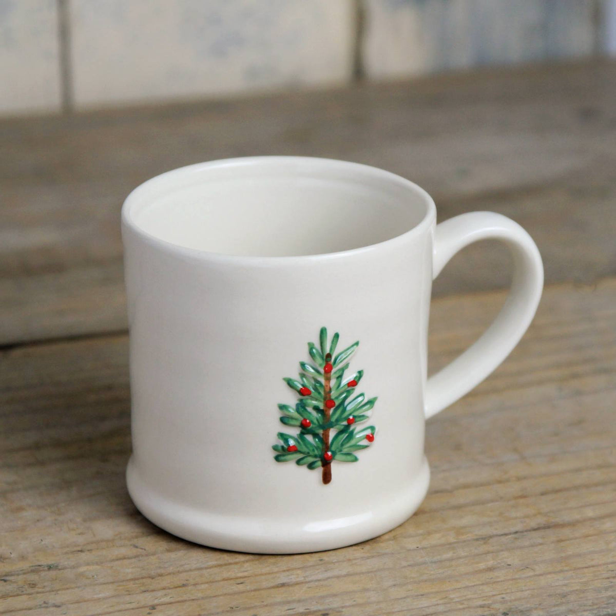 Small cream stoneware mug, with a Christmas Tree