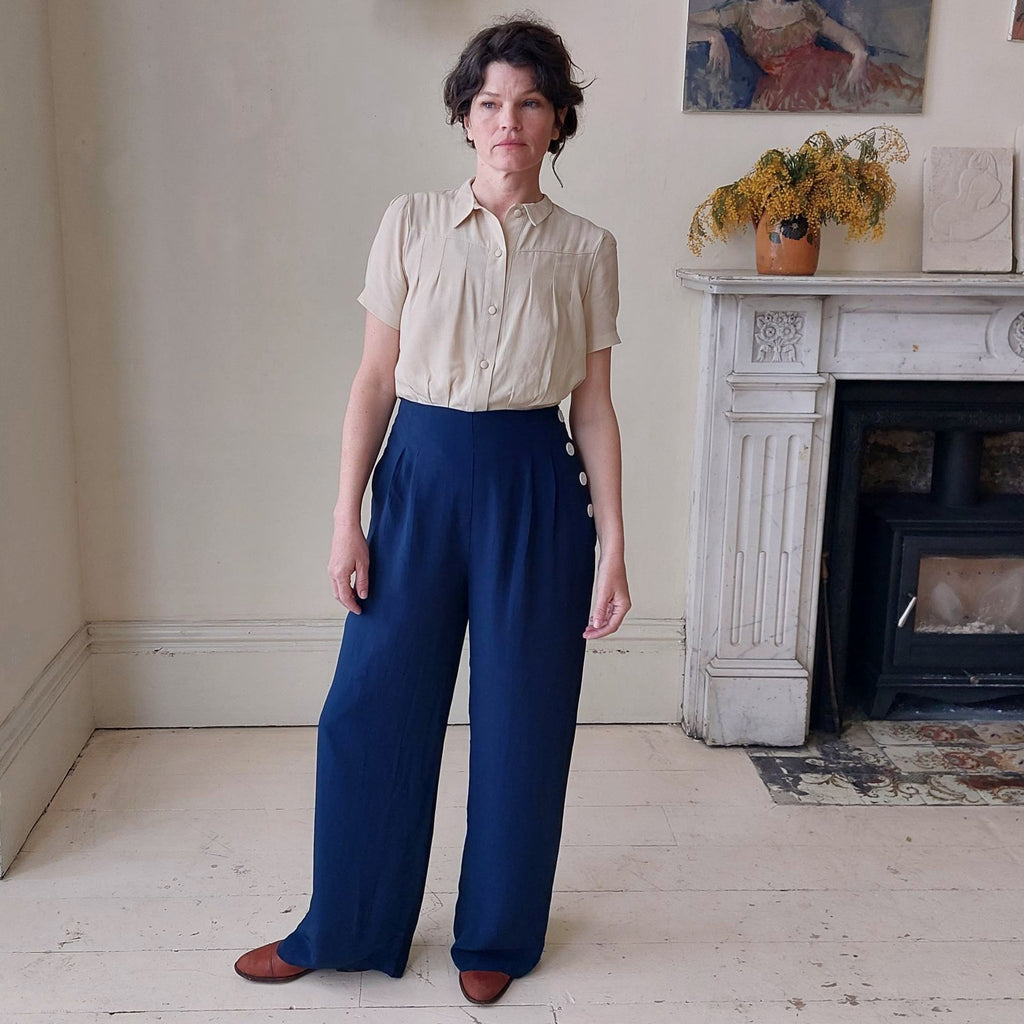 Classic 1940's high waisted, wide legged vintage trousers with white buttons down one side