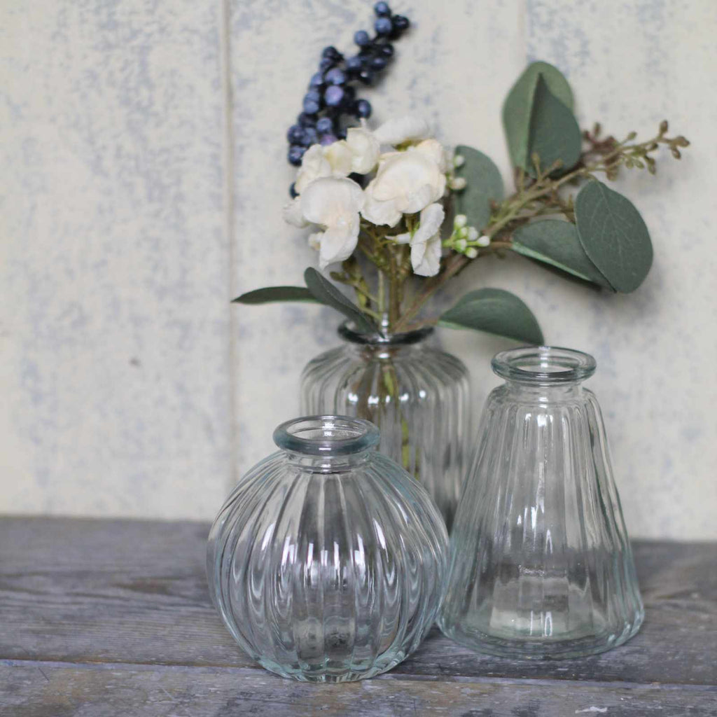 vintage glass vases in fluted, straight and round ribbed shapes