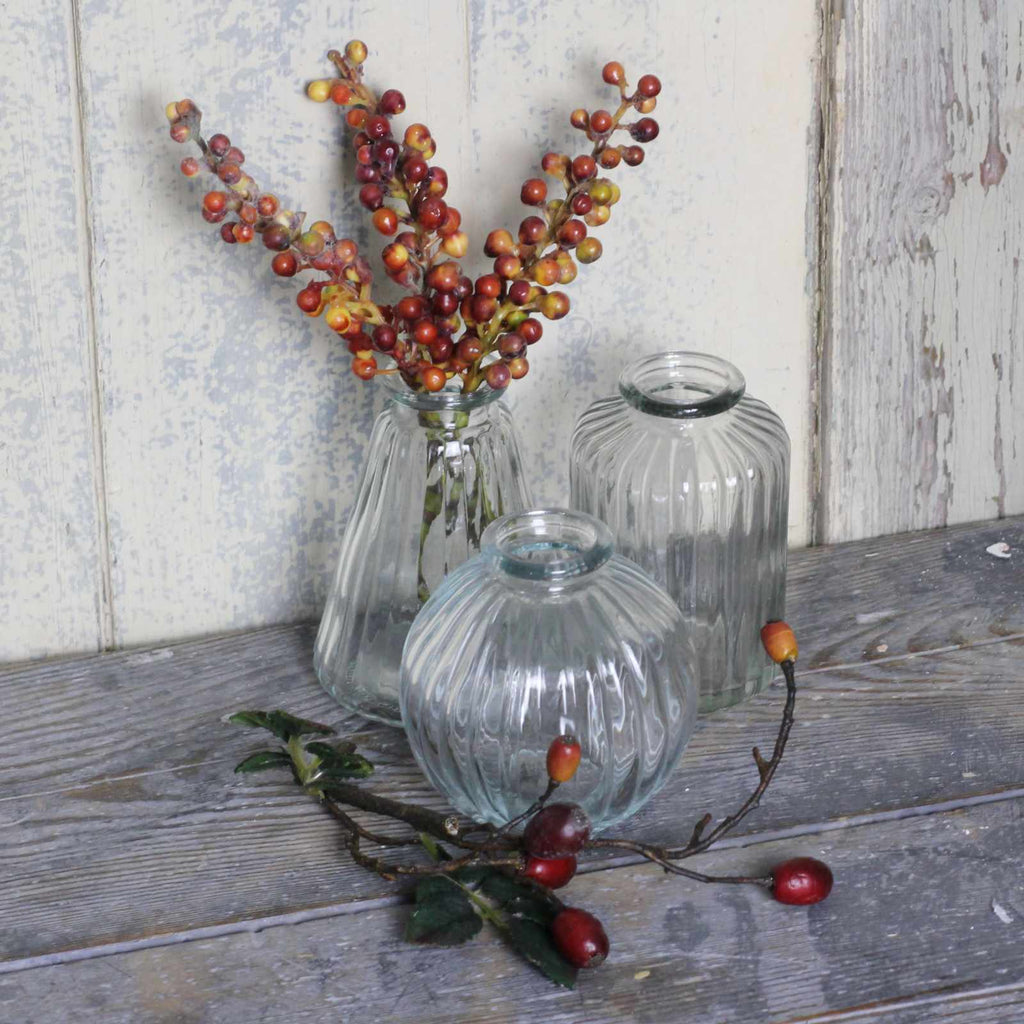 vintage glass vases with winter berries