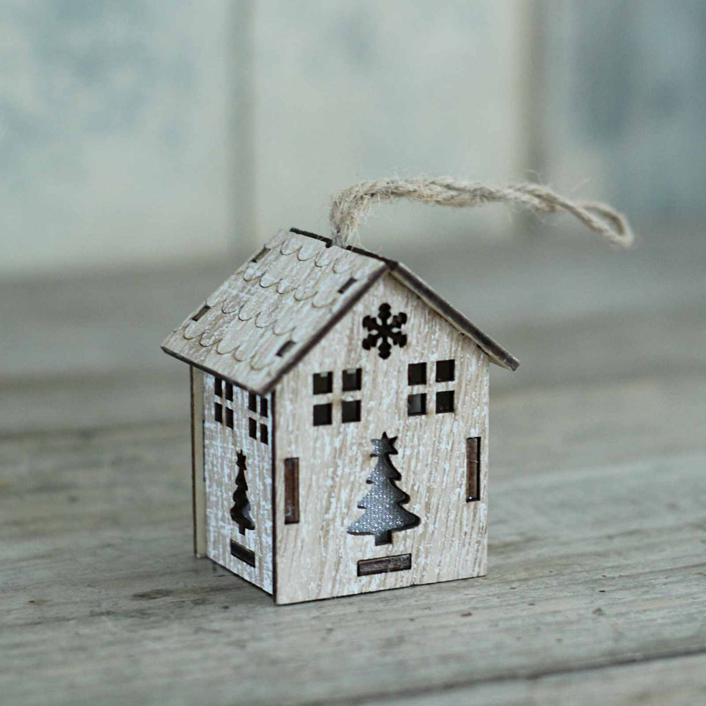 Christmas decoration - light up wooden Christmas cabin with Christmas tree