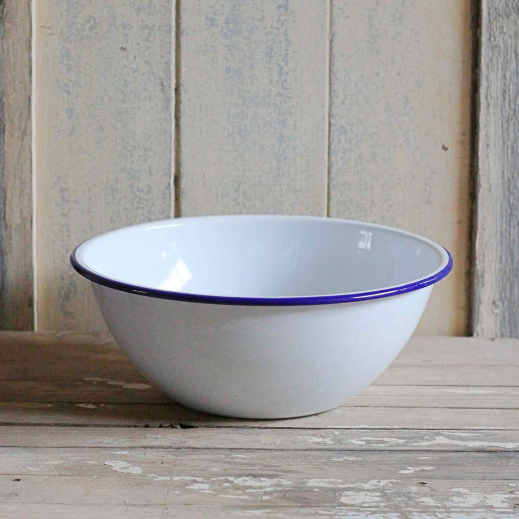 White enamel mixing bowl with blue rim