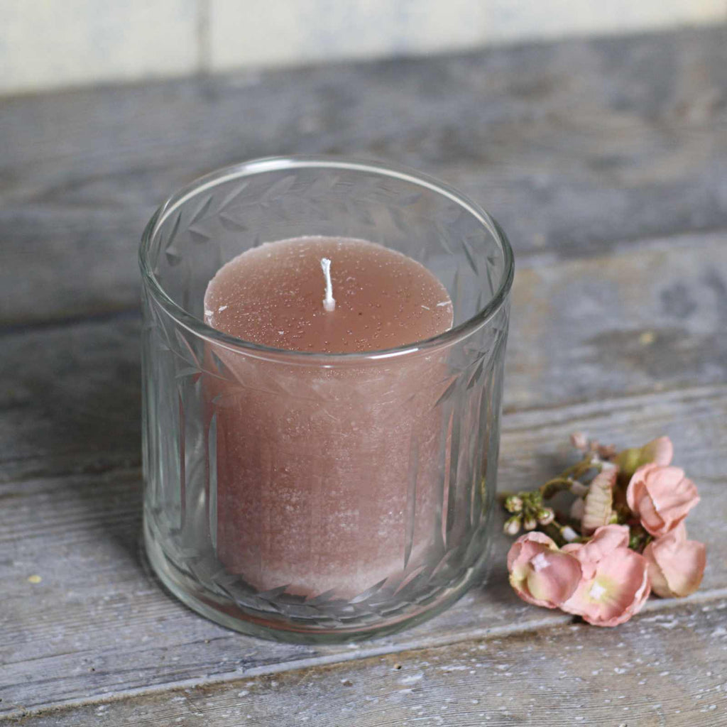 glass candle holder with pink pillar candle