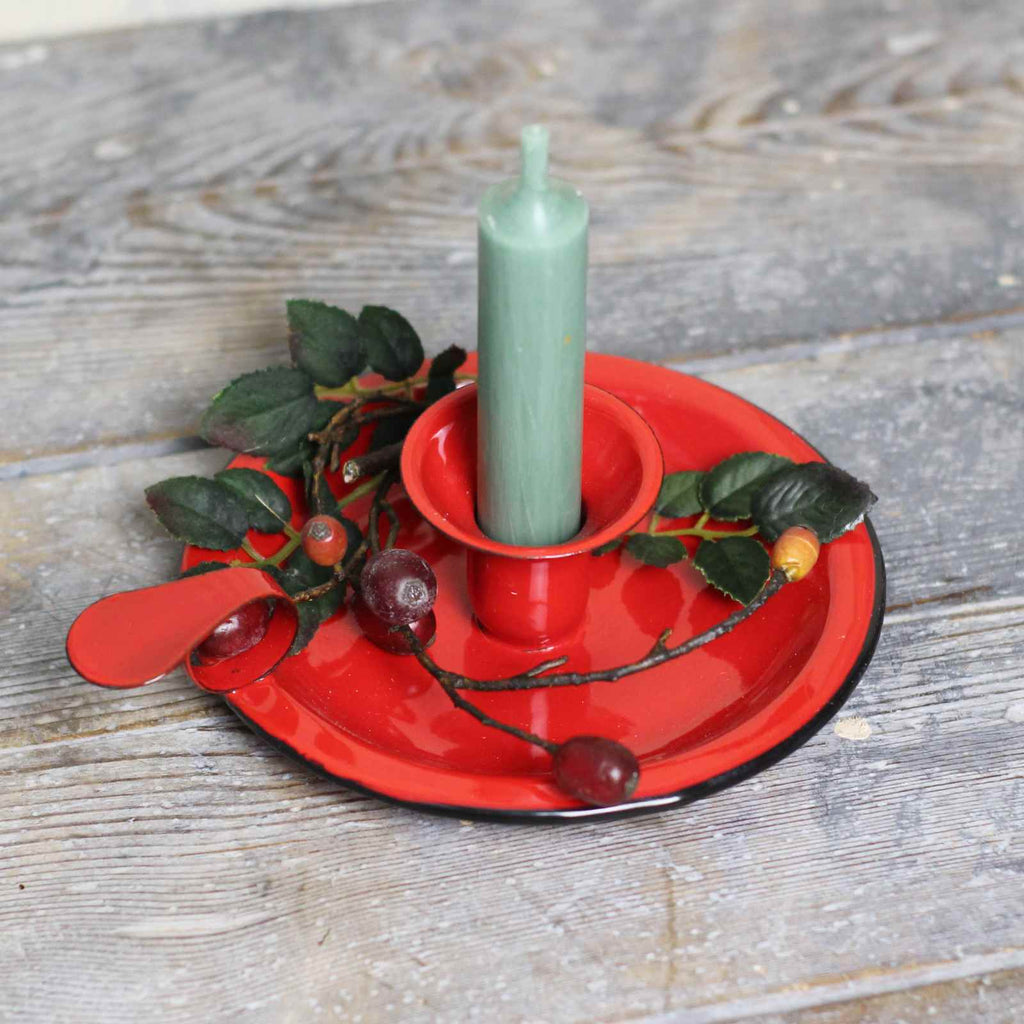 candle holder in red enamel with green candle