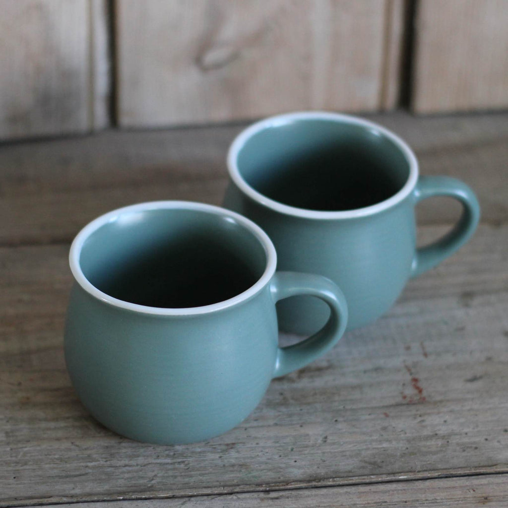 stoneware mug in green with white rim