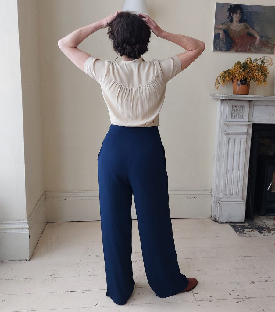 Classic 1940's high waisted, wide leg navy  vintage trousers with white buttons down one side
