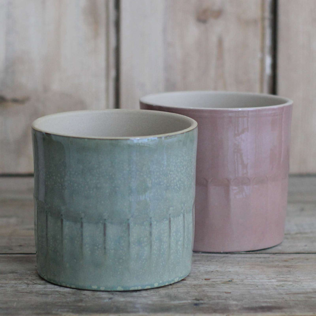 ceramic pots in indoor plants in sage and pale rose colours