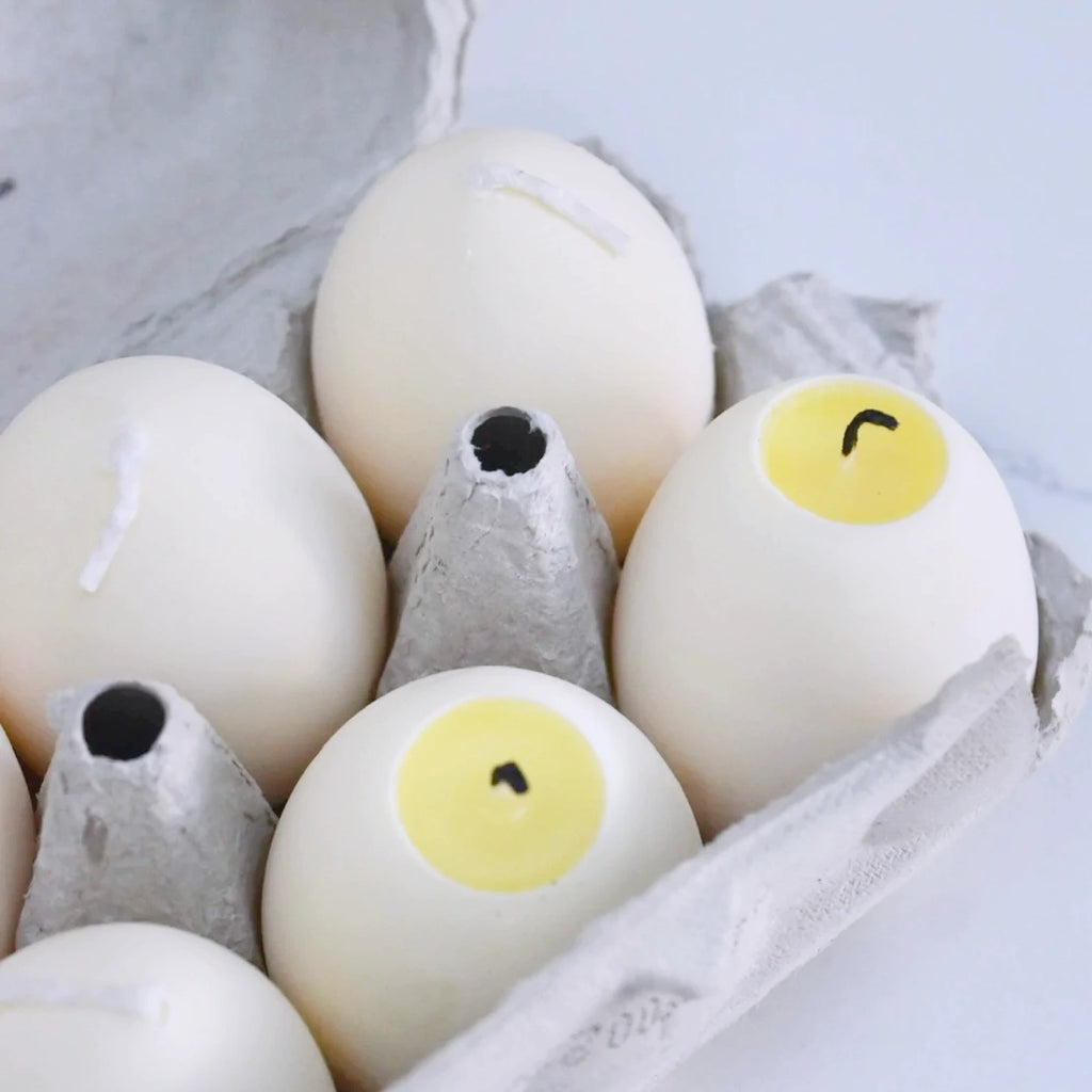 Egg Candle - White egg shaped candle with a yellow interior