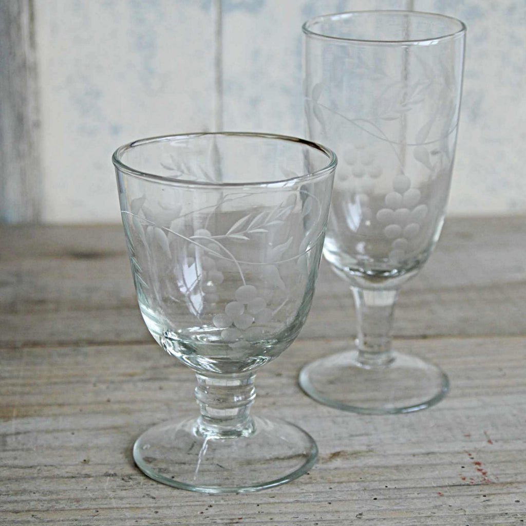 Elegant vintage style wine glass, hand blown and etched with a delicate pattern of rambling vine leaves. With matching Champagne glass