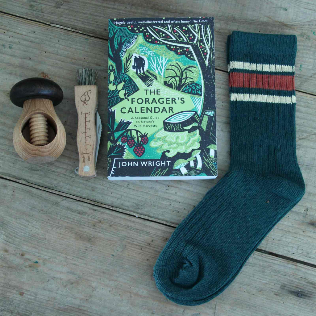 Boxed Gifts - Our 'Forager's' Gift Box contains a copy of 'The Forager's Calendar' by John Wright, a seasonal guide for anyone interested in wild food. Alongside this is a Mushroom Knife, a beech Mushroom Nutcracker, and a pair of Men's Ribbed Cotton Socks in Green & Rust.