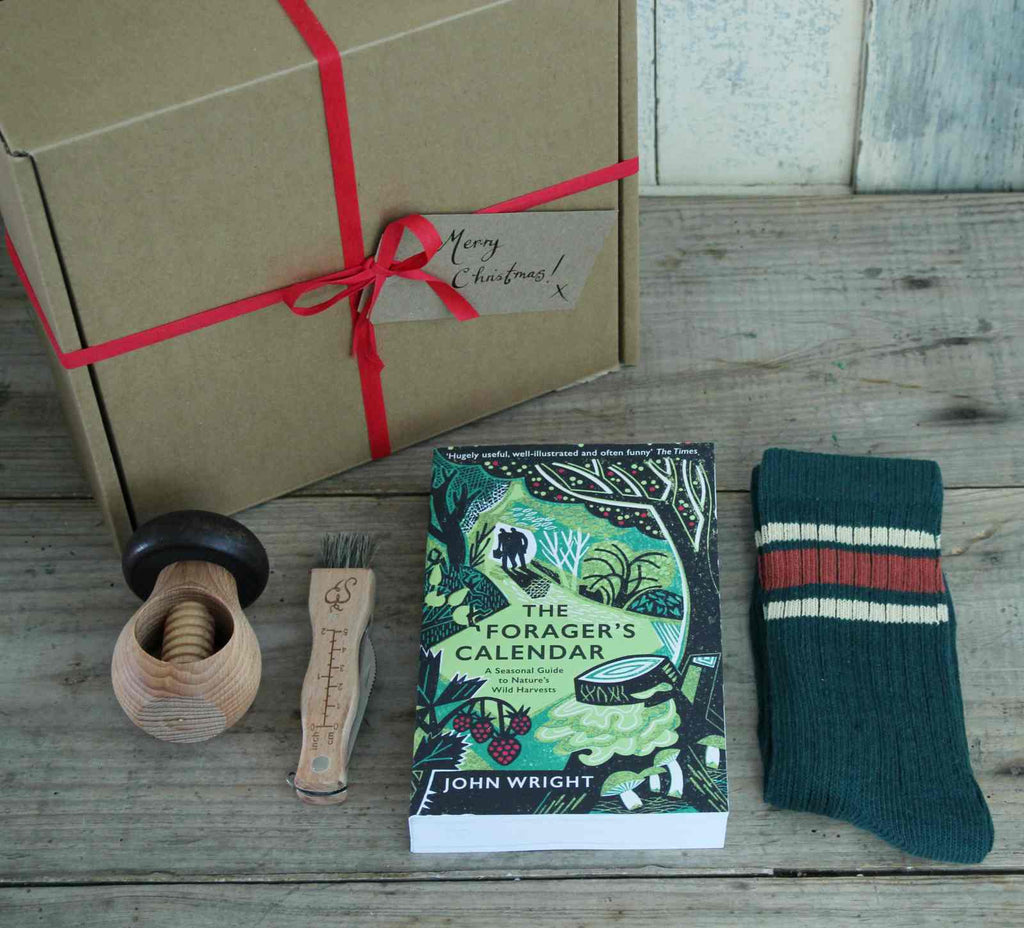 Boxed Gift - Our 'Forager's' Gift Box contains a copy of 'The Forager's Calendar' by John Wright, a seasonal guide for anyone interested in wild food. Alongside this is a Mushroom Knife, a beech Mushroom Nutcracker, and a pair of Men's Ribbed Cotton Socks in Green & Rust.