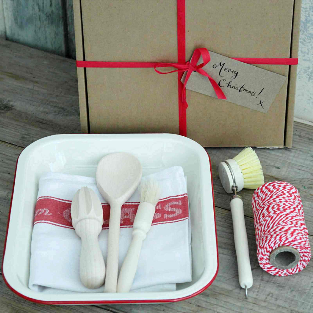 Boxed Gift - Our 'Kitchen' Gift Box contains an Enamel Roasting Dish in Cream & Red, a cotton Glass Cloth, a wooden spoon, a pastry brush, a beech lemon reamer and a wooden dish brush. All the cooking essentials!