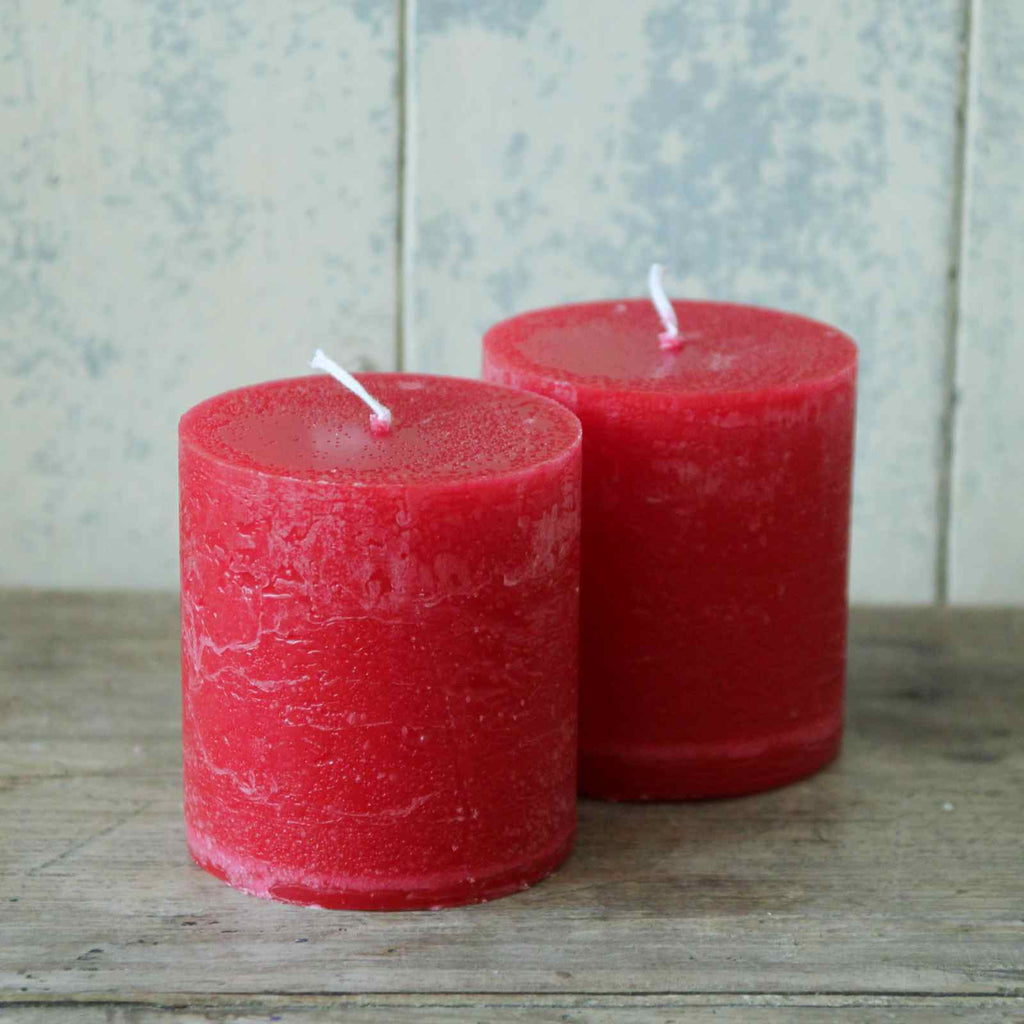 Rustic red pillar candle, perfect to create a warm glow for Christmas