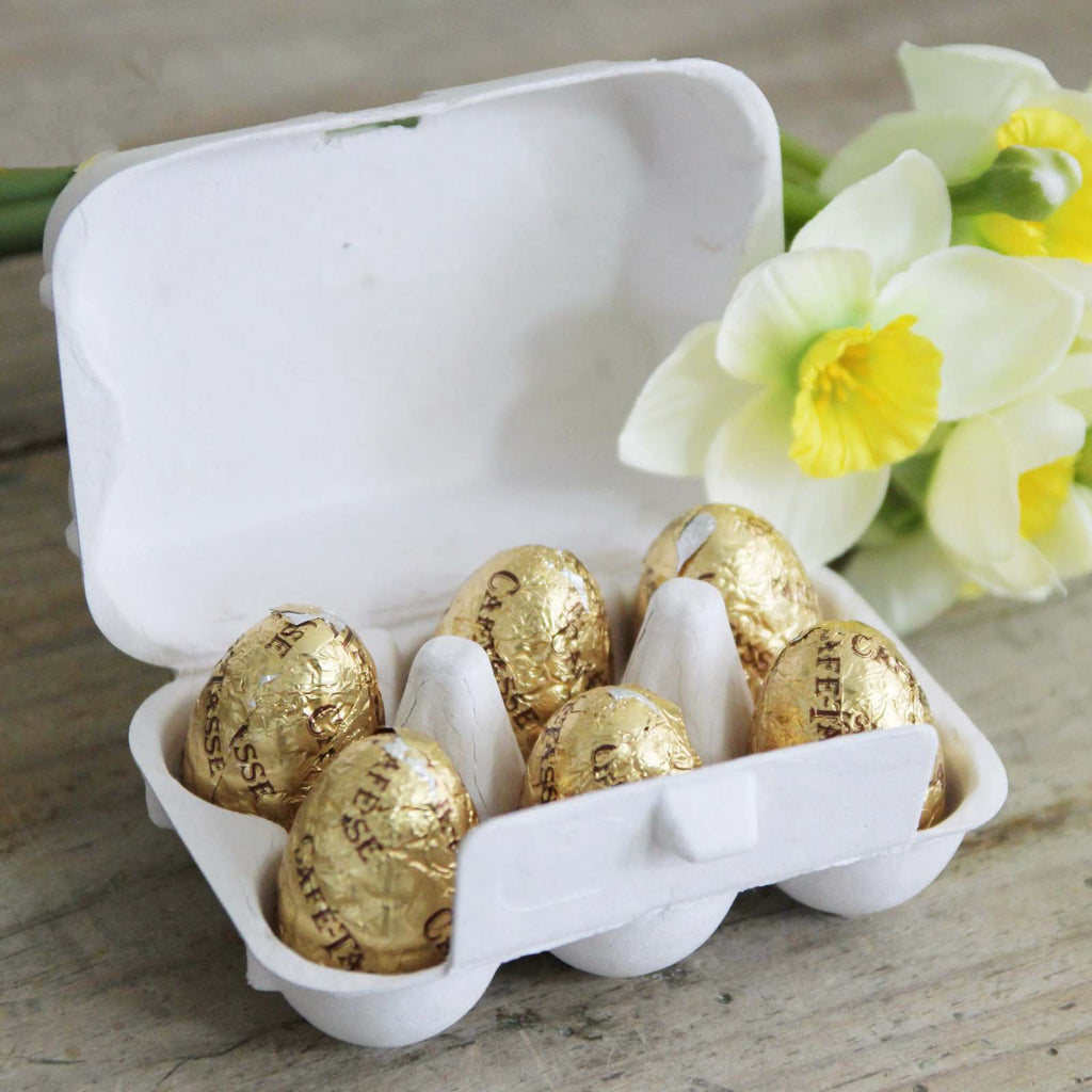 Six Milk Chocolate Praline Eggs in an adorable mini egg box with daffodils