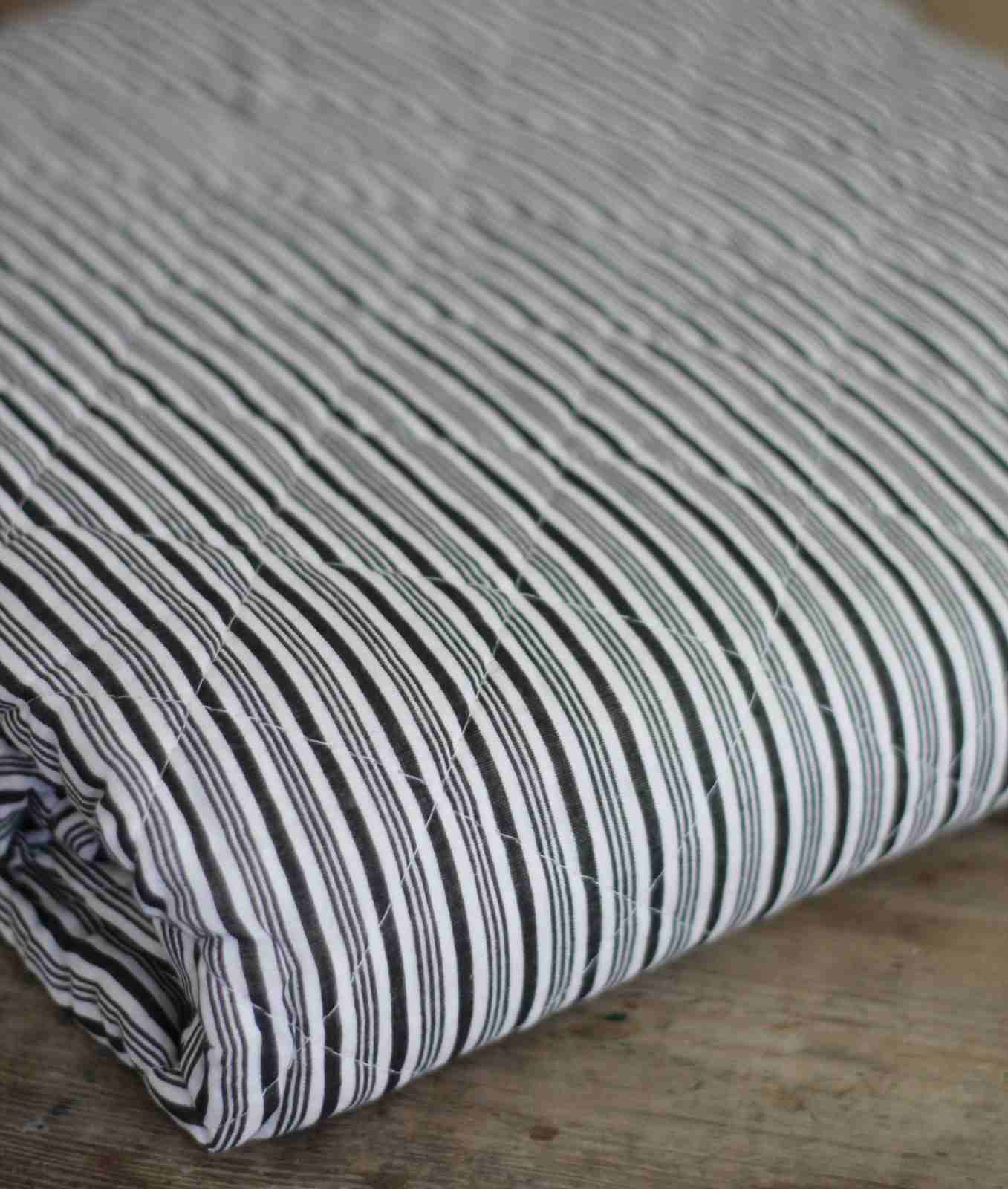 Quilted bedspread with black strip detail