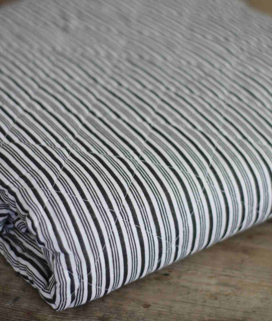 Quilted bedspread with black strip detail