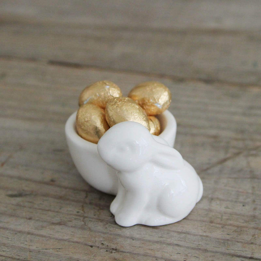 Easter Bunny Rabbit Egg Cup with gold Chocolate Eggs.
