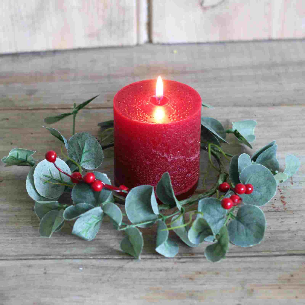 candle holder ring with eucalyptus and red berries