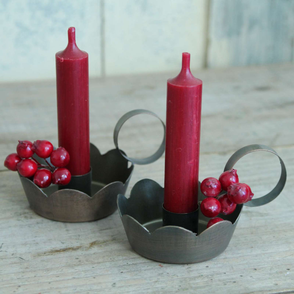 Scalloped Dinner Candle Holder in Brass with red candles and red berries