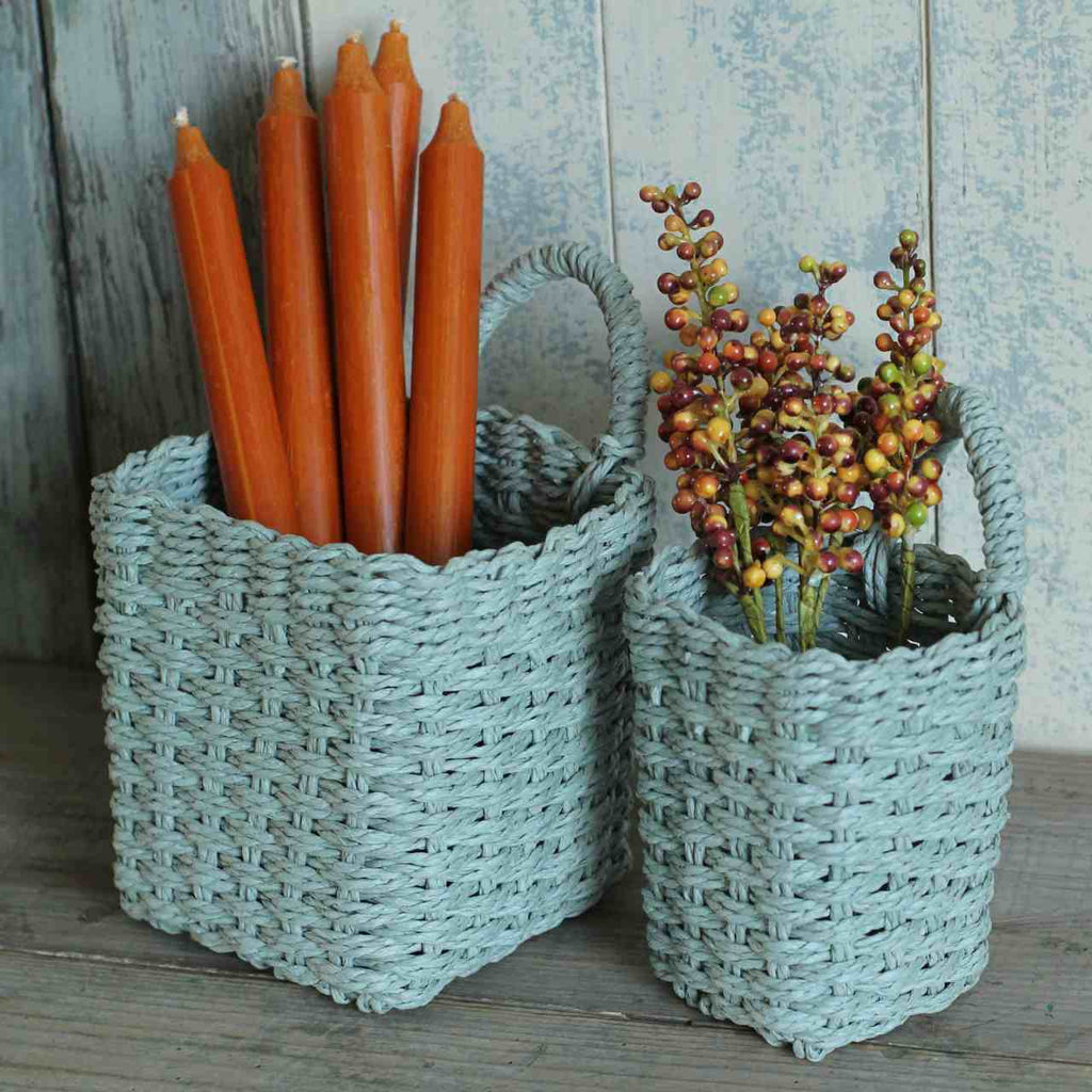 Set of hanging baskets with candles and Autumn berries