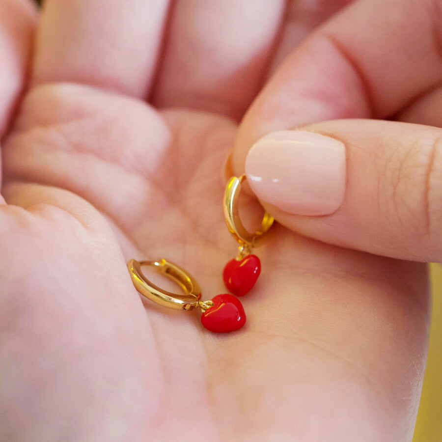 Tiny red enamel heart gold huggie earrings